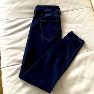 Dark-wash, stretch, high rise ankle skinny jeans.